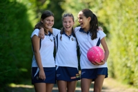 Description: Girls walking to netball