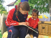 Description: Russell House Form 6 and Robins reading together